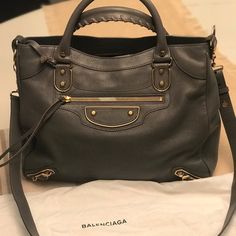 Balenciaga Hand Bag. Brand New With Tags Never Used Classic Gray Bags With Gold-tone Hardware, Luxury Gray Satchel Bag, Luxury Gray Shoulder Bag With Palladium Hardware, Luxury Gray Shoulder Bag With Dust Bag, Designer Gray Shoulder Bag For Travel, Designer Gray Shoulder Bag, Luxury Gray Top Handle Satchel, Designer Gray Leather Shoulder Bag, Designer Gray Bags For Daily Use