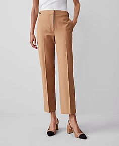 Elevate your wardrobe with the Ann Taylor Button Pencil Pant in Twill, a testament to sophistication and comfort. These pants are designed to flatter with a high-rise, tailored fit that sits just below the natural waist, and a slim leg that hits at the ankle. Perfect for both office and casual wear, these pants ensure you look polished and poised.

- Size: Regular - 2
- Color: Perfect Camel
- Gender: Female
- Material: 54% Viscose, 39% Cotton, 7% Lyocell
- Fit: Tailored and fitted
- Rise: High r Flat Front Bottoms For Workwear In Fall, Flat Front Pants For Workwear, Fall Season, Flat Front Pants For Fall Workwear, Chic Bottoms With Button Closure And Straight Hem, Elegant Brown Pants With Button Closure, Chic Tailored Bottoms With Flat Front, Versatile Brown Pants For Workwear, Spring Workwear Bottoms With Flat Front, Versatile Brown Bottoms For Workwear