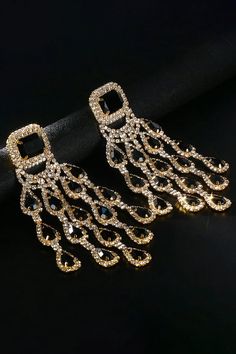 Elevate your style with our Diamond Floral Fringe Earrings. These stunning earrings showcase intricate diamond-encrusted floral designs with delicate fringe details. The combination of diamonds and cascading fringes adds a touch of sophistication and movement, making them a perfect accessory for special occasions. Embrace a look that effortlessly blends luxury and trendiness with these captivating earrings. Glamorous Gold Tassel Earrings With Rhinestones, Gold Crystal Tassel Earrings For Evening, Elegant Metal Earrings With Rhinestone Fringe, Gold Tassel Dangle Earrings With Rhinestones, Gold Rhinestone Tassel Dangle Earrings, Diamond Dangle Chandelier Earrings For Party, Diamond Chandelier Dangle Earrings For Party, Diamond Dangle Bridal Earrings For Party, Crystal Chandelier Earrings With Rhinestone Fringe