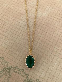 "Lovely and nicely detailed emerald green and gold tone necklace.  Green crystal oval stone is set in exaggerated crown detailed mounting. green stone necklace, green necklace, green crystal, green oval necklace, gold oval necklace, necklace green Pendant measures 5/8\" L X 1/2\" W and is on an 18\" chain. ★ Want to see more?  Please visit my shop at: https://www.etsy.com/shop/DesignsByPeg" Forest Green Necklace, Simple Green Necklace, Green Amulet Necklace, Oval Stone Necklace, Emerald Necklace Aesthetic, Antique Emerald Necklace, Gold Necklace With Green Stone, Oval Emerald Necklace, Emerald Green Necklace Jewelry