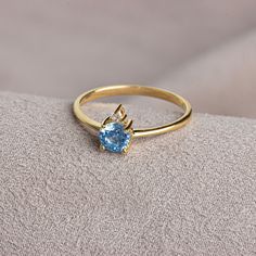 Aquamarine; It is also known as the stone of calmness and courage. The meaning of Aquamarine stone, which has a crystal structure, is sea water. Thanks to its blue color, it resembles streams and seas. Aquamarine is the birthstone for those born in March. Meet the essence of elegance: Solitaire aqumarine ring. Handcrafted with precision, this exquisite piece features a majestic sapphire set in a magnificent design. A symbol of timeless beauty, it embodies sophistication and elegance. Elevate you Elegant 14k Gold Topaz Birthstone Ring, Round Cut Gemstone Birthstone Promise Ring, Promise Ring With Round Cut Birthstone, Promise Round Cut Birthstone Ring, Promise Jewelry With Topaz Birthstone, 14k White Gold Topaz Birthstone Ring, Fine Jewelry Topaz Birthstone Promise Ring, Topaz Birthstone Promise Ring Fine Jewelry, Topaz Birthstone Promise Ring In Fine Jewelry Style