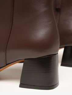 Crafted from smooth nappa leather, The Cristina bootie was designed with versatility in mind. Dress it up, dress it down, wear it with dresses, wear it with jeans. The classic silhouette—featuring an almond toe and walkable block heel—is essential to any cool-weather wardrobe. Classic Mid-calf Boots With Wide Calf And Block Heel, Classic Wide Calf Mid-calf Boots With Block Heel, Fall Chelsea Boots With Stacked Heel And Square Toe, Classic Square Toe Wide Calf Heeled Boots, Classic Block Heel Boots For Fall, Classic Fall Boots With Block Heel, Classic Wide Calf Heeled Boots With Square Toe, Classic Heeled Boots With Reinforced Heel And Square Toe, Leather Ankle Heeled Boots For Fall