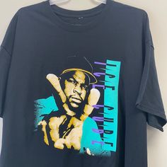 Ice Cube T-Shirt Nwot Bin 64 90s Black Crew Neck Top, 90s Black T-shirt With Graphic Design, 90s Style Black Shirt With Graphic Print, Black 90s Style T-shirt For Fan Merchandise, 90s Style Black Relaxed Fit T-shirt, 90s Black Relaxed Fit T-shirt, Black 90s Style Relaxed Fit T-shirt, Black Relaxed Fit 90s T-shirt, 90s Style Black Screen Print Tops