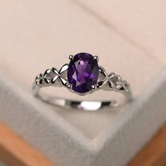 Elegant Oval Cabochon Amethyst Rings, Elegant Amethyst Oval Cabochon Ring, Elegant Sterling Silver Amethyst Ring Oval Cabochon, Elegant Purple Amethyst Ring Oval Cabochon, Elegant Purple Oval Cabochon Amethyst Ring, Oval Birthstone Ring With Prong Setting In Sterling Silver, Oval Sterling Silver Birthstone Ring With Prong Setting, Classic Silver Amethyst Ring With Oval Cabochon, Oval Amethyst Ring In Sterling Silver For Anniversary