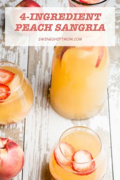 two glasses filled with peach sangria on top of a wooden table