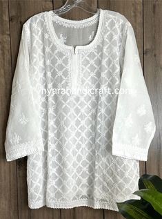 Soft cotton Chikankari hand embroidered blouse. Liner included  Length: 30 inches Luxury Fitted Blouse With Chikankari Embroidery, Luxury Chikankari Embroidery Blouse Piece In Katan Silk, Luxury White Blouse Piece With Chikankari Embroidery, White Long Sleeve Blouse With Chikankari Embroidery, Chikankari Embroidered Top For Festivals, Festive Chikankari Embroidered Straight Kurta Top, Traditional Chikankari Embroidered Top For Festive Occasions, Chikankari Embroidered Top For Eid Festive, Traditional Long Sleeve Embroidered Top For Navratri