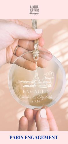 a person holding an award in front of the eiffel tower with text that reads, paris engagement