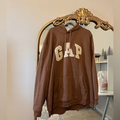 Got My Hands On This Brown Gap Hoodie But It’s Too Big For Me :( These Are Selling For $90+ Online So This Is A Steal! Looks Brand New! Gap Sweatshirt With Letter Print For Streetwear, Gap Hoodie With Letter Print For Fall, Sporty Gap Hoodie For Fall, Gap Hooded Hoodie For Fall, Gap Hoodie With Letter Print For Streetwear, Gap Hooded Tops For Fall, Gap Sweatshirt With Adjustable Hood For Fall, Gap Crew Neck Hoodie For Streetwear, Gap Long Sleeve Hoodie For Streetwear