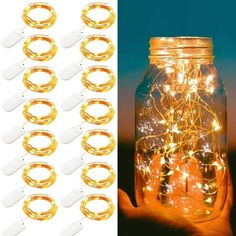 a mason jar filled with lots of lights next to a hand holding two gold rings