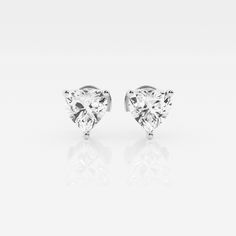 The Ethereal .50ct Trillion Stud Earrings will be your favorite pair for effortless everyday radiance. Featuring standout lab grown trillion cut diamonds set against 14K gold, this easy style will go with everything. The distinctive trillion cut offers a magnificent level of brilliance, so you can shine from the inside out. Classic Cubic Zirconia Heart Cut Diamond Earrings, Classic Heart Cut Cubic Zirconia Diamond Earrings, Classic Heart Cut Brilliant Earrings, Classic Brilliant Cut Heart Earrings For Formal Occasions, Classic Heart Earrings With Brilliant Cut For Formal Occasions, Classic Diamond White Heart Earrings With Brilliant Cut, Classic Heart-shaped Diamond Earrings With Vvs Clarity, Classic Heart Earrings In Brilliant Cut Diamond White, Classic Heart Cut Brilliant Diamond Earrings