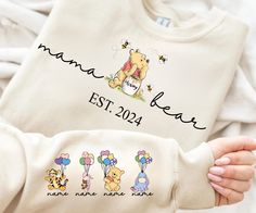 Personalized Mama Bear Winnie T-Shirt,Sweatshirt,Hoodie,Custom Name Kids Shirt, Mom Shirt, Mama Bear Shirt, Mother's Day Shirt Gift For Mom Sweatshirts (no hood) & Hoodies (with hoods) M A T E R I A L S * Gildan® Heavy Blend™ Adult Hooded Sweatshirt * 50% Cotton / 50% Polyester * Classic Fit * Fabric 271 g/m² * Preshrunk fleece knit * Double-lined hood with color-matched drawcord * Double needle stitching at shoulder, armhole, neck, waistband and cuffs * Pouch pocket * 1 x 1 rib with spandex * A Wine Red Sweater, Bear Clothing, Mama Bear Shirt, Hoodie Hood, Bear Shirt, Mama Sweatshirt, Custom Sweatshirts, Bear T Shirt, Mom Sweatshirt