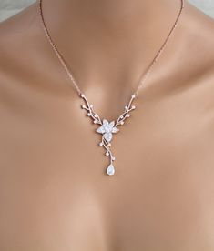 "Dainty Rose gold Bridal backdrop necklace and earrings set. Created in a lovely vine floral design that sparkles with Swarovski Pure Brilliance stones - Necklace measures 16 inches and extends to 18 inches - Backdrop measures 9 inches - You can choose a removable backdrop option in the drop down menu. This gives you an option to be able to wear the necklace alone without the backdrop. - Earrings dangle 1-3/8\" - Rose gold finish - Swarovski Pure Brilliance stones - Nickel free - Available in ro Bridal Backdrop Necklace, Rose Gold Bridal Earrings, Gold Bridal Necklace, Backdrops Necklace, Bridal Earrings Drop, Gold Bridal Earrings, Rose Gold Bridal, Necklace Rose Gold, Gelang Manik