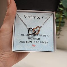 ♥ Mother Son Necklace:- The love between a mother and son is forever♥ Mother Birthday Gift From Son: - Two hearts embellished with Cubic Zirconia stones, interlocked together as a symbol of never-ending love. Made with high-quality brass over white and rose gold plating. The cable chain measures 16 inches with a 2-inch extension and fastens with a lobster clasp.♥ Mother’s Day Present From Son: - When you wear this mother-son jewelry close to your heart, it lovingly collapses time and space if yo Stainless Steel Jewelry For Anniversary, Mother's Day Gift, Meaningful Black Jewelry For Mother's Day, Black Jewelry For Anniversary, Mother's Day Gift, Black Jewelry For Anniversary And Mother's Day, Black Jewelry For Anniversary Gift On Mother's Day, Sterling Silver Necklaces For Mother's Day, Stainless Steel Double Heart Necklace For Mother’s Day, Sterling Silver Jewelry For Mother's Day, Silver Necklace For Mother's Day