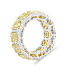 18kt Yellow Gold and Platinum Diamond Eternity Wedding Band: 12 fancy yellow cushions in halo setting 8.40cts fancy yellow diamonds and 1.40cts white diamonds Size: 6.5 Luxury Yellow Diamond Ring With Pave Setting, Yellow Diamond Ring With Cushion Cut, Yellow Cushion Cut Diamond Ring With Halo Setting, Yellow Diamond Ring With Pave Setting For Wedding, Yellow Diamond Rings With Halo Design, Formal Yellow Diamond Ring With Pave Setting, Yellow Cushion Cut Cubic Zirconia Diamond Ring, Yellow Diamond Ring With Halo, Yellow Cubic Zirconia Cushion Cut Diamond Ring