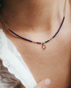 Our lapis lazuli gold choker with tiny lapis lazuli beads, labradorite and blue topaz pendant and gold accents. Ideal to wear in summer, this navy blue necklace looks amazing with its matching bracelet and in any summer event, next to the beach and lighted by the sun. This gold necklace with small blue gemstone beads is perfect as a September or December birthstone gift, when the lapis lazuli crystal takes on even more significance.  ** D E T A I L S ** Gemstones size we use are lapis lazuli and labradorite 2mm beads and blue topaz pendant 7mm. Materials: lapis lazuli, labradorite and blue topaz gemstones, 18k gold plated chain and gold plated extender.  Gemstones we use in our necklaces may have some slight variation of tone. Every natural stone is special and unique, that's the idea! ** Adjustable Lapis Lazuli Jewelry With Faceted Beads, Sapphire Beaded Necklaces With Natural Lapis Lazuli Stones, Spiritual Lapis Lazuli Jewelry With Faceted Beads, Dainty Blue Gemstone Jewelry, Blue Labradorite Bohemian Jewelry, Blue Spiritual Birthstone Jewelry, Bohemian Blue Labradorite Jewelry, Elegant Lapis Lazuli Necklace With Faceted Beads, Yellow Gold Lapis Lazuli Jewelry With Natural Stones