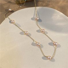 ✦ Channel timeless beauty with our Dainty Pearl Link Chain Necklace. This delicate necklace features a stunning link chain embellished with exquisite pink pearls, creating a harmonious blend of elegance and femininity. The pearls dangle gracefully along the chain, adding movement and allure to the design. Whether you're dressing up for a romantic date or adding a touch of refinement to your everyday attire, this pearl link chain necklace is a stunning and versatile accessory that will enhance your style. - Color: Ivory / Pink - Materials: Alloy, Gold Plated, Faux Pearl - Necklace Length: 47.6cm - SKU: HN1120 Necklace Clasp, Pearl Chain Necklace, Pink Pearls, Basic Jewelry, Necklace Clasps, Nose Rings Hoop, Romantic Date, Crystal Hoop Earrings, Link Chain Necklace