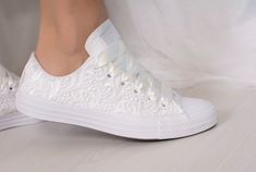 "Our current production time is 1-5 weeks.If you need the shoes faster than that you can add our rush order to your cart : https://www.etsy.com/listing/673922760/ Made with love for your wedding day by Lovin Bridal - More Wedding shoes at our shop : http://lovincollection.etsy.com It's the bride's prerogative to wear the comfiest wedding shoes. If you're set on heels then one option is to have your Lace Bridal Converse tennis shoes as a second pair of wedding shoes to change into for the recepti White Lace-up Wedding Shoes With White Laces, White Lace-up Wedding Shoes, White Lace-up Wedding Shoes For Bridal Shower, Low-top Wedding Shoes With White Laces, Elegant White Low-top Wedding Shoes, Elegant White Sneakers For Bridal Shower, Lace Converse, Wedding Sneakers For Bride, Bride Converse