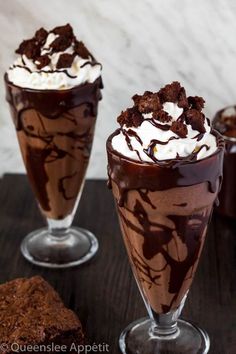 two glasses filled with ice cream and chocolate