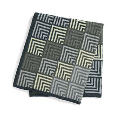 two black and white squares are on top of each other, one is made out of fabric