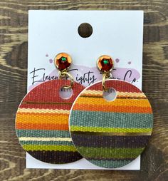 Description: Elevate your style with our Handmade Round Paper Striped Earrings, a perfect blend of eco-conscious craftsmanship and vibrant design. These eye-catching earrings are made from high-quality paper, creating a lightweight and unique accessory. Features: Material: Durable paper  Design: Circular shape with bold, colorful stripes Size: 2 inches in diameter Hooks: Hypoallergenic and nickel-free ear wires for sensitive ears Eco-Friendly: Made with sustainable materials and techniques Why You'll Love Them: These earrings are not just accessories; they're a statement. Handcrafted with attention to detail, each pair offers a one-of-a-kind chic and environmentally friendly look. Perfect for adding a pop of color to any outfit, they're versatile enough for both casual and formal occasions Multicolor Drop Earrings For Everyday, Handmade Retro Everyday Earrings, Handmade Retro Earrings For Everyday Wear, Retro Multicolor Earrings With Ear Wire, Orange Circular Earrings For Gift, Orange Circle Earrings For Gift, Modern Multicolor Earrings For Everyday, Bohemian Multicolor Clip-on Earrings For Gift, Bohemian Multicolor Clip-on Earrings As A Gift