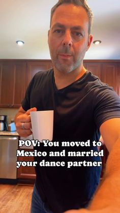 a man holding a coffee cup in his right hand with the caption pov you moved to mexico and married your dance partner