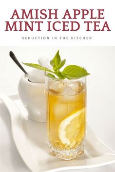 an iced tea in a glass on a white plate with the title, amish apple minted tea