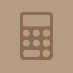 a brown calculator on a tan background with white dots in the bottom right corner