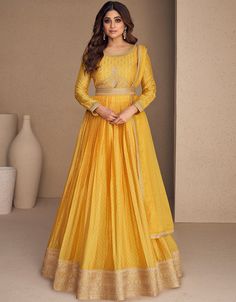 🌼 Embrace Vibrant Yellow Glamour! Discover our Yellow Chinon Silk Anarkali - a perfect blend of tradition and modern allure. Ideal for creating a striking and stylish look that exudes confidence. Get ready to make a fashionable statement with your refined fashion sense and capture attention with your vibrant style! ✨👗 #ArabicAttireFashion #YellowChinonAnarkali #EleganceInYellow #ModernTradition #AnarkaliGlam Yellow Anarkali Dress, Anarkali Lehenga Gowns, Yellow Dupatta, Yellow Anarkali, Silk Anarkali, Gown With Dupatta, Anarkali Lehenga, Latest Salwar Kameez, Gown Suit