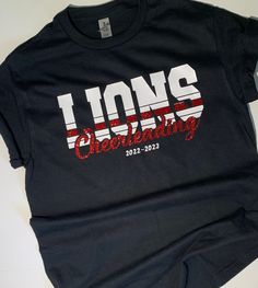 a black t - shirt with the words lions celebrating on it's front and back