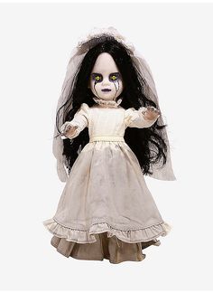 a doll dressed up as a bride with long black hair and white make - up