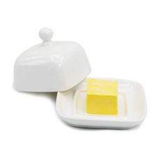 two pieces of yellow cake sitting on top of a white plate next to each other