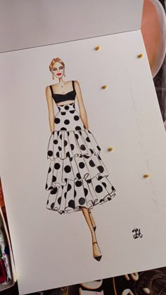 a drawing of a woman's dress with polka dots on it