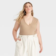 Upgrade your loungewear wardrobe with this Sleeveless Rib Bodysuit from Universal Thread™. The sleeveless bodysuit features a V-neckline and 2 X 2 ribbed construction, taking you from running errands to lunch with friends in chic style. The soft, stretchy fabric keeps you in cool comfort, while a crotch snap closure lends functional detail to your look. Pair with your favorite pair of bottoms to complete the look. Universal Thread™: Found exclusively at Target. Casual Seamless V-neck Bodysuit, Summer V-neck Ribbed Bodysuit, Chic Sleeveless Bodysuit For Loungewear, Spring Sleeveless Ribbed Bodysuit, Casual V-neck Bodysuit For Loungewear, Solid Color Ribbed V-neck Bodysuit, Chic Sleeveless Cotton Bodysuit, Solid Ribbed V-neck Bodysuit, Solid Color V-neck Bodysuit For Loungewear