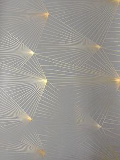 an abstract wallpaper with gold lines on it