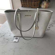 Michael Kors White & Gold Jet Set Travel Carry All Tote Leather Optic White See Photos For Details And Condition Matching Wallet In Closet Original Price With Shipping And Tax $335.00