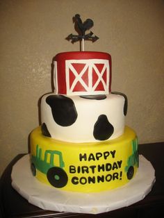 a birthday cake with a farm theme on the front and sides, decorated like a tractor