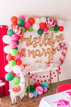 a room decorated with balloons and decorations