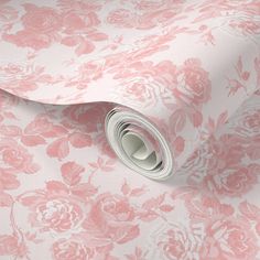 a pink floral wallpaper with roses on it