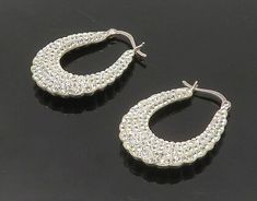 "925 Sterling Silver - Cubic Zirconia Encrusted Fluted Hoop Earrings - EG8929  925 Sterling Silver - Cubic Zirconia Encrusted Fluted Hoop Earrings - EG8929  Jewelry Type:         Earrings   Metal Type:            925 Silver   Metal Size:             1.25\"  Stone Type:            Cubic Zirconia   Condition:              N/A  Jewelry Weight:     7.9 Grams  PLEASE NOTE: THIS ITEM IS PRE-OWNED. ALTHOUGH MOST ITEMS ARE IN VERY GOOD CONDITION, SOME MAY NEED CLEANING AND/OR MINOR REPAIRS. WE MAKE A VERY STRONG EFFORT TO UPLOAD CLEAR PICTURES. PLEASE INSPECT ALL PICTURES AND ASK ALL QUESTIONS YOU MAY HAVE PRIOR TO MAKING A PURCHASE. NOT ALL STONES ARE GENUINE, SOME ARE ENHANCED OR CREATED." Dazzling Cubic Zirconia Hoop Earrings With Rhinestones, Diamond Hoop Earrings With Rhinestones, Diamond Rhinestone Hoop Earrings, Elegant Bling Hoop Earrings For Anniversary, Silver Cubic Zirconia Bling Earrings, Anniversary Rhinestone Hoop Earrings, Anniversary Hoop Earrings With Rhinestones, Elegant Rhinestone Hoop Crystal Earrings, Anniversary Round Hoop Earrings With Rhinestones