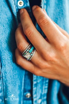 a woman's hand with a ring on her finger