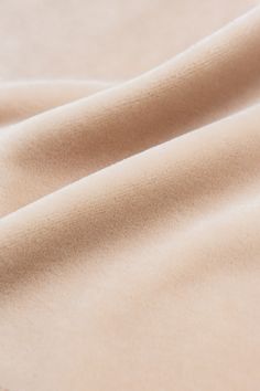 a close up view of a beige fabric