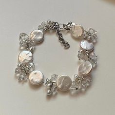 "✿ Made with glass beads, freshwater pearls, and metal accents ✿ Clear and milky white ✿ 7.5\" plus 1.5\" of extension chain" Gothic Bracelet, Strawberry Flower, Butterfly Bracelet, Metal Accents, Milky White, Flower Bracelet, Photo Bracelet, Phone Charm, Metallic Accents