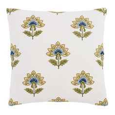 a white pillow with blue flowers on it