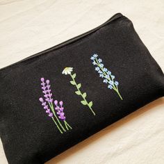 Handpainted black school pencil case with flowers. Ideal for storing anything: pencils, markers, makeup...  It's perfect for school, to go on a trip as a toiletry bag and it's an ideal complement to our bags where we can store the smallest things and not lose them.  The measurements are: 21cm x 13cm (8,27" x 5,12") I tell you how I painted it:  First, I wash the pencil case. This is how I get the final size of the pouch (you will not be surprised when washing it because it already has its final Black Zipper Pencil Case For Personal Use, Rectangular Black Pencil Case With Pen Holders, Black Rectangular Pencil Case, Black School Bags With Pen Holders, Black School Pouch With Pen Holders, Black Pouch With Pen Holders For School, Black Rectangular Everyday Pencil Case, Rectangular Black Everyday Pencil Case, Black Travel Cosmetic Bag With Pen Holders