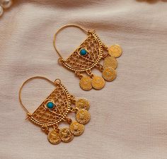 These Oriental earrings are artfully designed pieces of jewelry that have their origins in the rich cultural traditions of the Middle East, Asia and North Africa. These earrings are often characterized by their opulent and detailed workmanship, reflecting the diversity and richness of the respective cultures. Turquoise Dangle Jewelry For Festivals, Turquoise Jewelry With Latkans For Festivals, Traditional Turquoise Jewelry With Latkans, Turquoise Latkans Jewelry For Festivals, Festive Turquoise Jewelry With Latkans, Turquoise Chandbali Jewelry With Latkans, Traditional Turquoise Drop Earrings, Traditional Turquoise Earrings With Latkans, Artisan Gold Hoop Earrings For Festivals