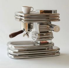 an espresso machine is stacked on top of each other