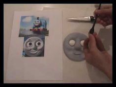 someone is cutting out a thomas the train photo