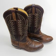 Step Out In Style With These Boss Men's Brown Cowboy Boots. Made With Western Snakeskin Leather And Phoenix Stitch, These Boots Are Perfect For Any Occasion. The Mid-Calf Shoe Shaft Style And Pointed Toe Toe Shape Give These Boots A Classic Look. The Pull On Closure And Snakeskin Feature Add A Touch Of Modernity To These Boots. These Boots Are Versatile, Suitable For Travel, Casual, And Workwear. The Leather Outsole Material And Leather Upper Material Ensure Durability And Comfort. In Excellent Condition With Minimal Signs Of Wear On Boot Shaft, Foot Or Heel. See Photos For Full Condition Description. Mens Boots Online Western, Brown Crocodile Pattern Snip Toe Boots, Luxury Crocodile Pattern Snip Toe Cowboy Boots, Men’s Western Boots, Mens Cowboy Boots Boot Barn, Brown Cowboy Boots, Boss Man, Western Cowboy Boots, Mid Calf