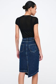 Let your style play by its own rules with our LES Denim Skirt. This striking pencil skirt's asymmetrical hem winds around and meets at an eye-catching right angle in both the front and back. Complete with five pockets, LES is as sharp and individual as the women who wear her. [SPLIT] Astrid is 5'9" (175 cm) tall, wearing size 25. Total length from below the waist is approximately 22.5" (57.5 cm). European Denim (100% Cotton). Turn inside out for better washing results. Machine wash on delicate c Edgy High Rise Fitted Denim Skirt, Edgy Fitted Dark Wash Skirt, Edgy Fitted Dark Wash Denim Skirt, Fitted Dark Wash Asymmetrical Denim Skirt, Fitted Asymmetrical Denim Skirt In Dark Wash, Fitted Dark Wash Asymmetrical Skirt, Fitted Asymmetrical Dark Wash Denim Skirt, Fitted Asymmetrical Dark Wash Skirt, Fitted Asymmetrical Skirt In Dark Wash