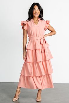 Chrysanthi Tiered Dress | Dusty Coral Feminine Maxi Dress With Flutter Sleeves And Ruffle Hem, Feminine Tie Waist Maxi Dress For Brunch, Feminine Maxi Dress With Tie Waist For Brunch, Elegant Pink Maxi Dress With Flutter Sleeves, Pink Flowy Ruffle Sleeve Midi Dress, Pink Maxi Dress With Ruffle Hem, Pink Chic Maxi Dress With Flutter Sleeves, Elegant Pink Belted Maxi Dress, Chic Pink Maxi Dress With Ruffle Hem